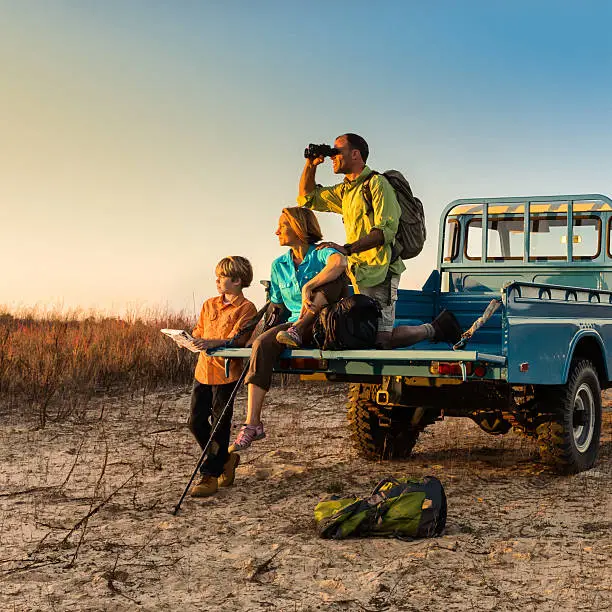 Family watching wildlife on safari